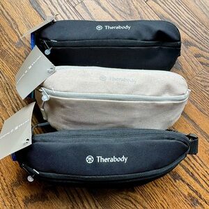 Set of THREE Therabody crossbody bags filled with travel products
